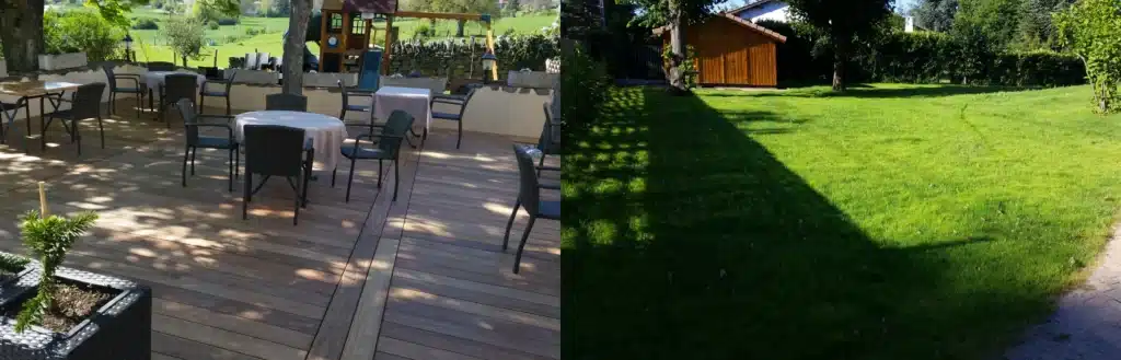 Aménagement jardin : terrasse en bois et pelouse verdoyante Terrasse en bois avec mobilier de jardin à gauche et vaste pelouse avec abri de jardin à droite.
